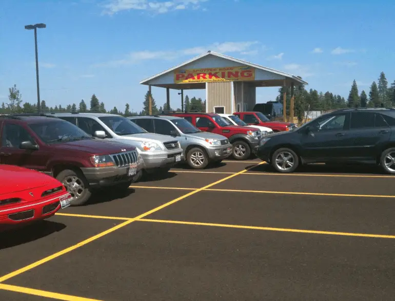 spotted road parking express spokane county logo